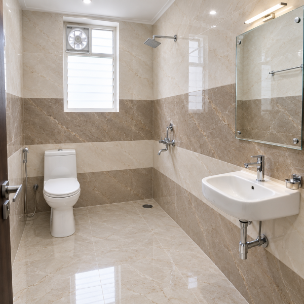 Modern bathroom, contemporary bathroom, luxury bathroom, stylish bathroom, clean bathroom, compact bathroom, toilet, western toilet, ceramic toilet, bathroom fixtures, wall mounted shower, shower head, water heater, electric geyser, wash basin, bathroom sink, chrome faucet, handheld bidet, health faucet, glass shelf, ventilation window, exhaust fan, patterned tiles, geometric tiles, grey tiles, white tiles, dark grey tiles, textured walls, tiled floor, marble effect, modern interiors, residential bathroom, home bathroom, bathroom design, interior design, sanitaryware, plumbing fixtures, bathroom accessories, minimalist bathroom, functional bathroom, bright bathroom, clean tiles, modern home, apartment bathroom, Indian bathroom, contemporary decor, utility space, indoor plumbing, sleek fixtures.